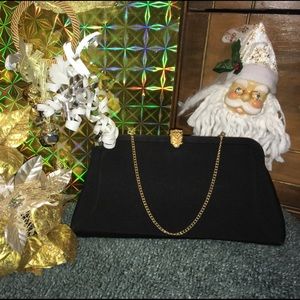 Sophisticated black clutch with goldtoned clasp